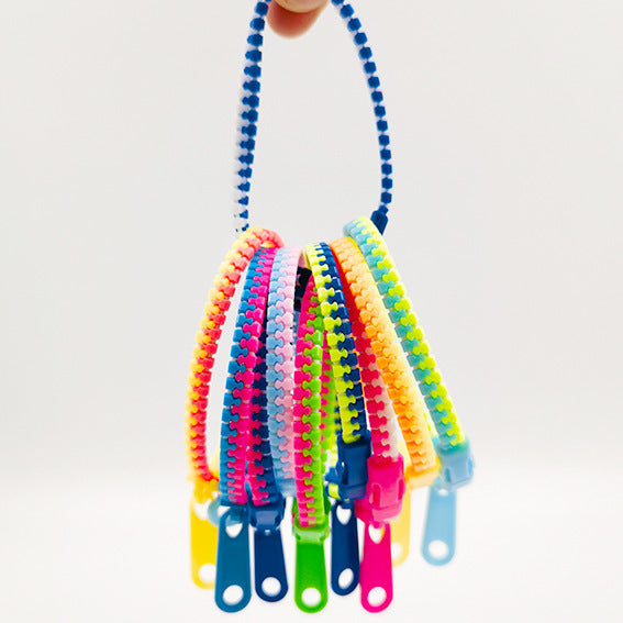 Bonbonfarbenes zweifarbiges Reißverschlussarmband für Kinder