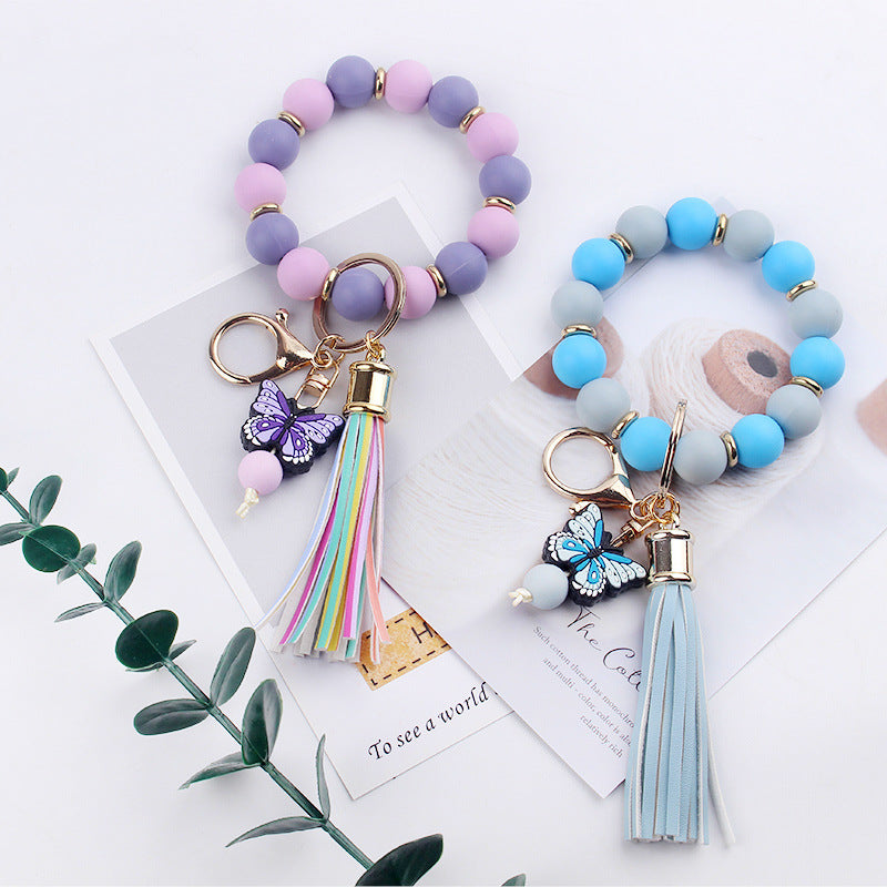 Kreativer DIY-Schlüsselanhänger mit Perlen und Cartoon-Schmetterling