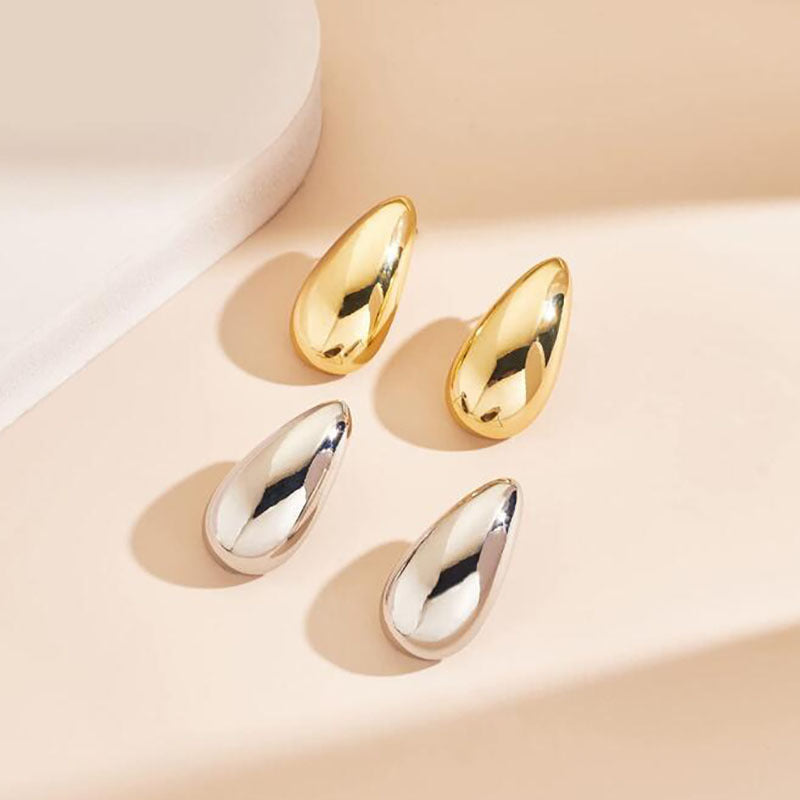 Metall-Wassertropfen-Ohrringe mit einem Gefühl von Nischen-Luxus